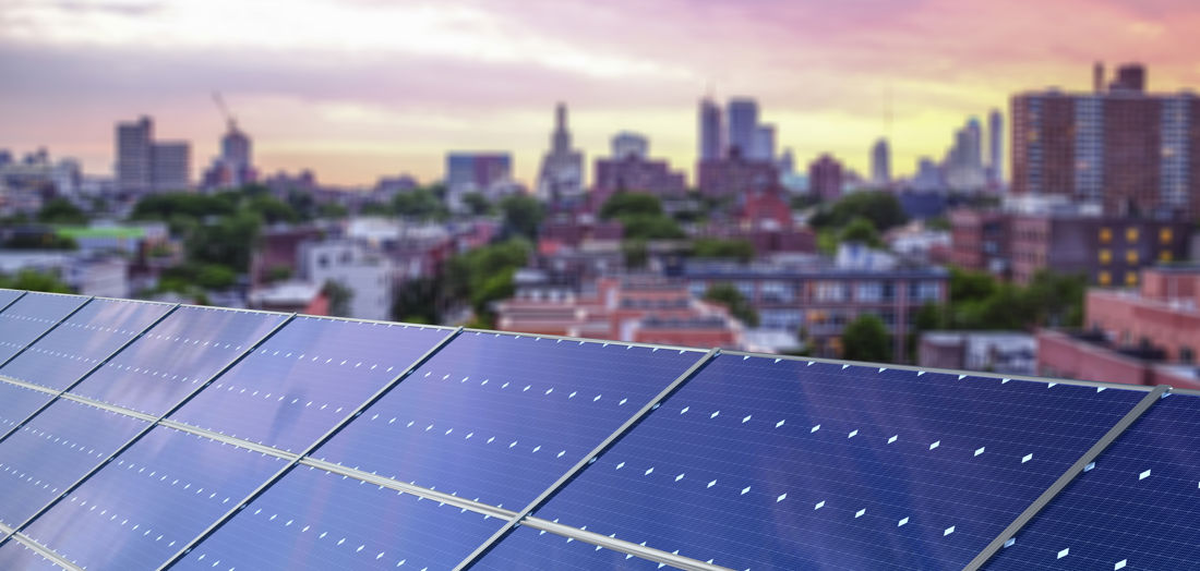 Rooftop solar overlooking a city